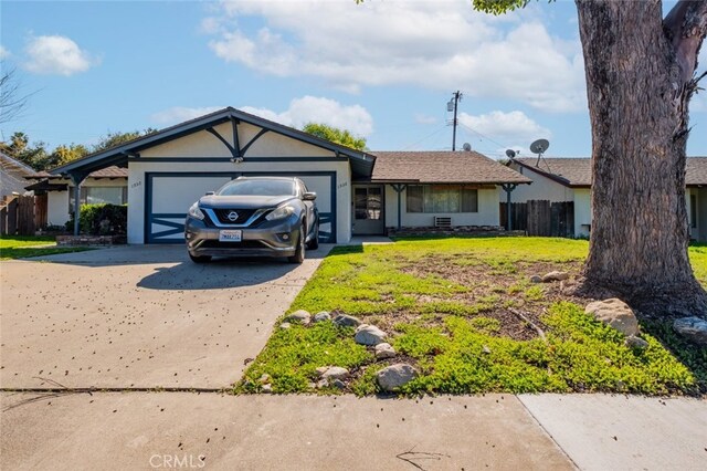 1936 Royalty Dr, Pomona, CA 91767 - ranch-style home with driveway, an attached garage, fence, and stucco siding