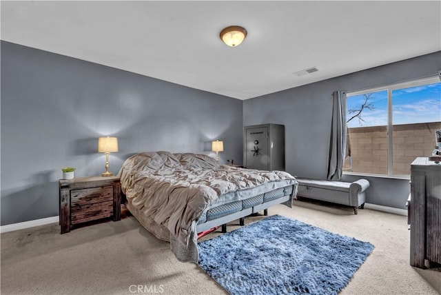 bedroom with baseboards, visible vents, and carpet flooring