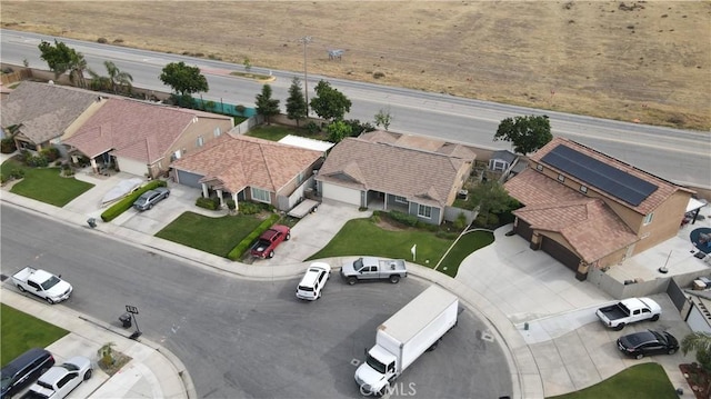 birds eye view of property with a residential view
