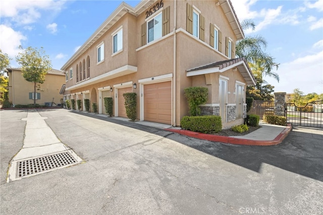 26336 Arboretum Way Unit 3703, Murrieta, CA 92563 - view of property featuring a garage