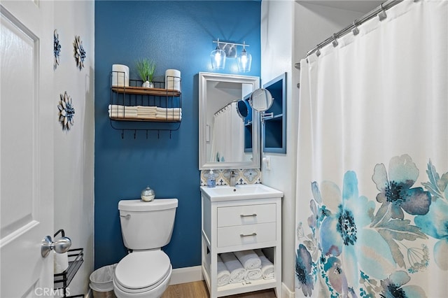 full bath featuring vanity, toilet, wood finished floors, and a shower with shower curtain