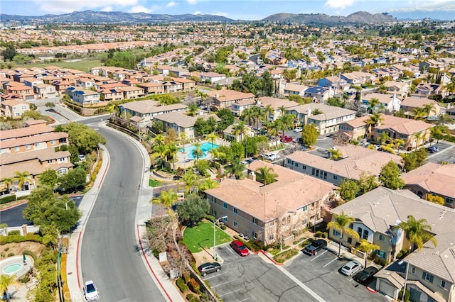 birds eye view of property with a mountain view and a residential view