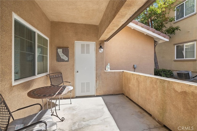exterior space featuring cooling unit and a balcony