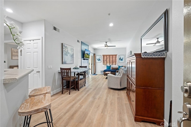 interior space featuring recessed lighting, baseboards, visible vents, and light wood-type flooring