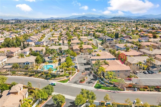 birds eye view of property with a residential view and a mountain view