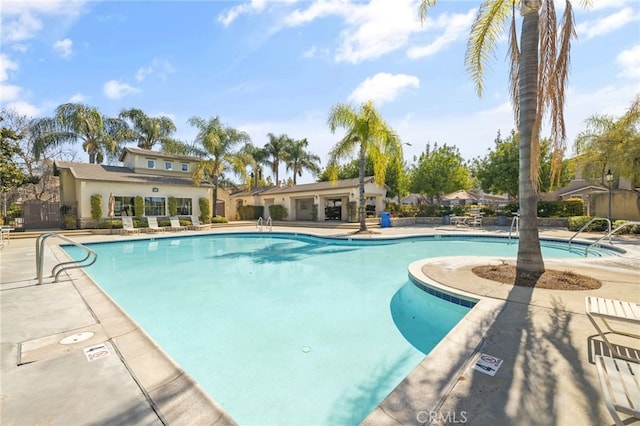 community pool with a patio