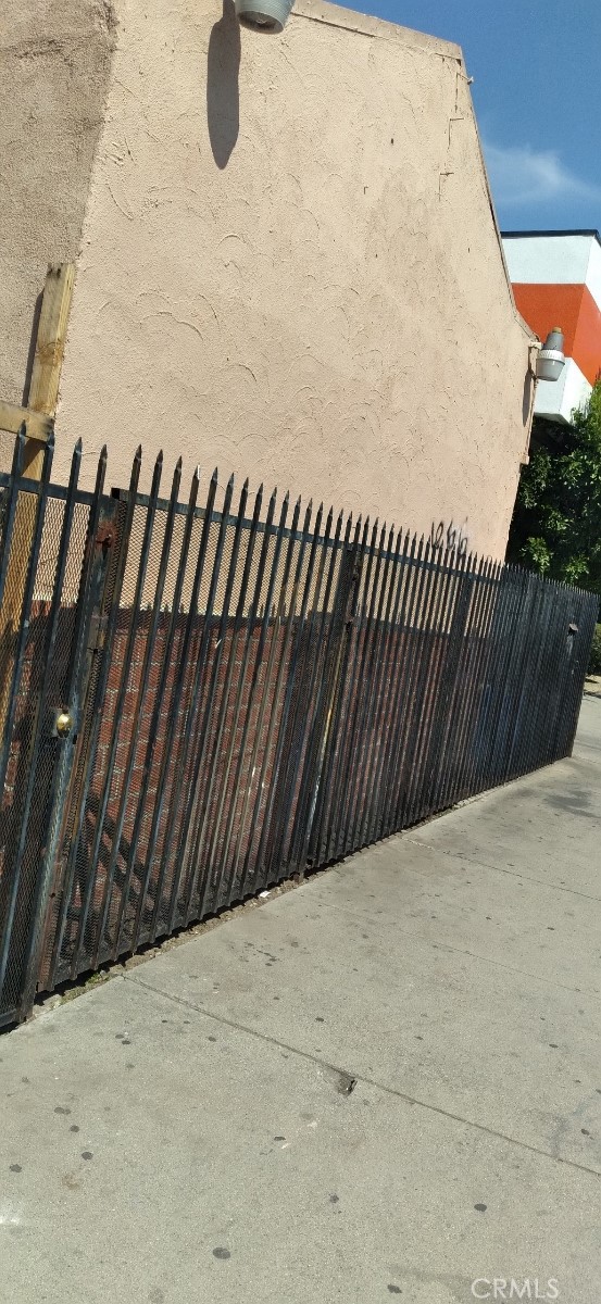 125 W Vernon Ave, Los Angeles, CA 90037 - view of gate featuring fence