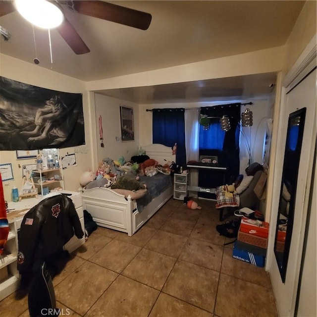 125 W Vernon Ave, Los Angeles, CA 90037 - tiled bedroom featuring a ceiling fan