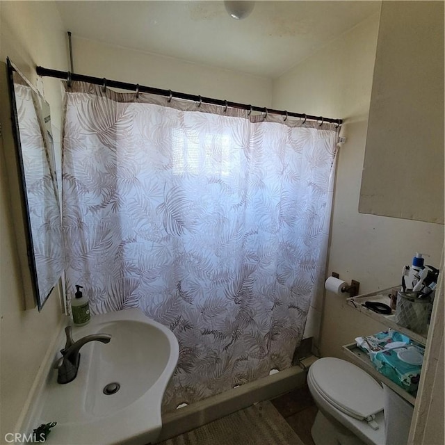 125 W Vernon Ave, Los Angeles, CA 90037 - full bathroom featuring toilet, a sink, and a shower with shower curtain