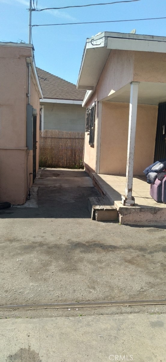 125 W Vernon Ave, Los Angeles, CA 90037 - view of home's exterior featuring a shingled roof