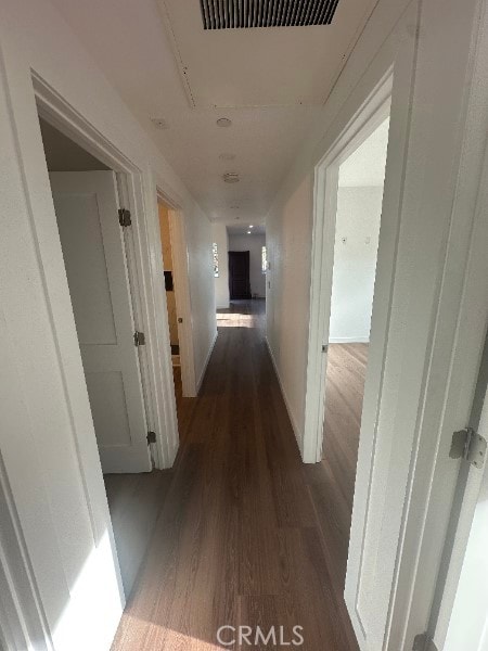 12929 Van Nuys Blvd, Pacoima, CA 91331 - hall with baseboards, visible vents, and wood finished floors
