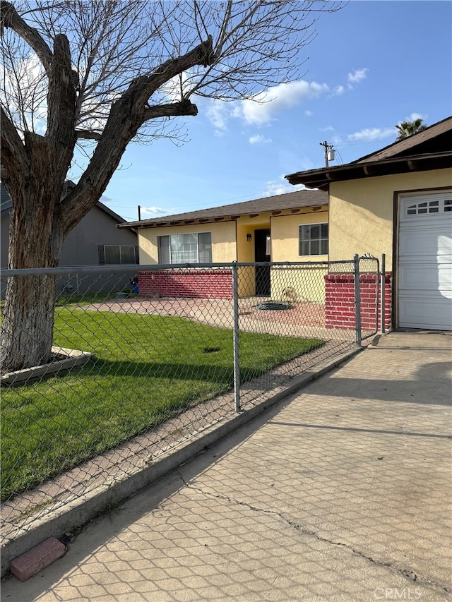 3816 Phaffle Dr, Bakersfield, CA 93309 - view of front of house with stucco siding, driveway, and an attached garage