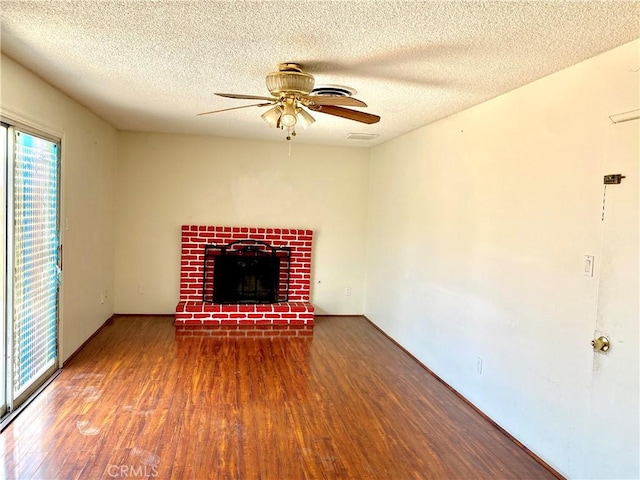 3816 Phaffle Dr, Bakersfield, CA 93309 - unfurnished living room featuring wood finished floors, ceiling fan, a textured ceiling, and a brick fireplace