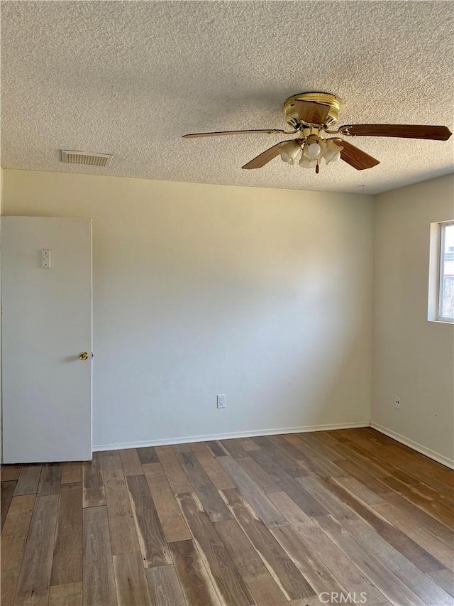 3816 Phaffle Dr, Bakersfield, CA 93309 - empty room featuring a textured ceiling, wood finished floors, and ceiling fan