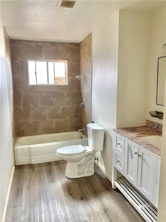 3816 Phaffle Dr, Bakersfield, CA 93309 - bathroom with wood finished floors, vanity, and  shower combination