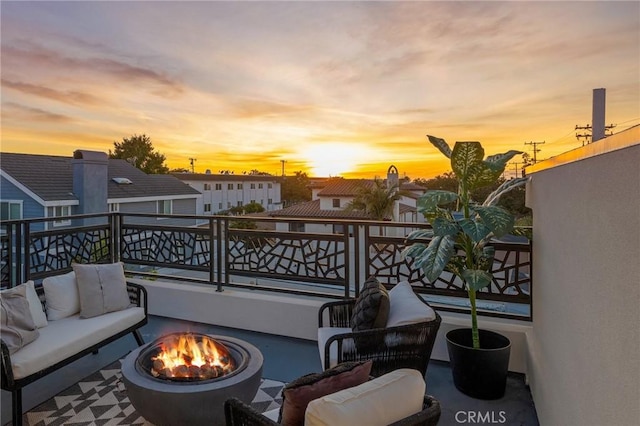 201 S Juanita Ave, Redondo Beach, CA 90277 - patio terrace at dusk with a balcony and an outdoor living space with a fire pit