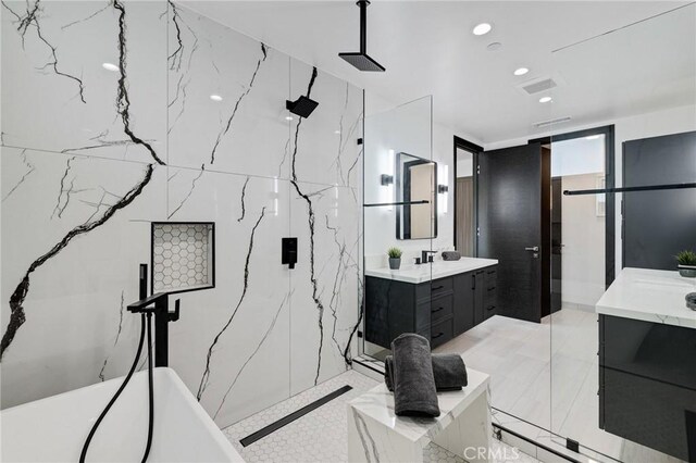201 S Juanita Ave, Redondo Beach, CA 90277 - bathroom with two vanities, a marble finish shower, a freestanding tub, and recessed lighting