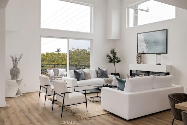 201 S Juanita Ave, Redondo Beach, CA 90277 - living area featuring a towering ceiling and wood finished floors