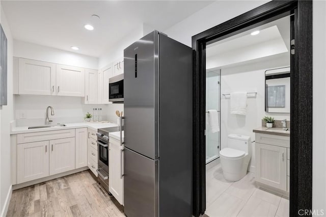 201 S Juanita Ave, Redondo Beach, CA 90277 - kitchen featuring stainless steel appliances, light countertops, white cabinetry, and recessed lighting