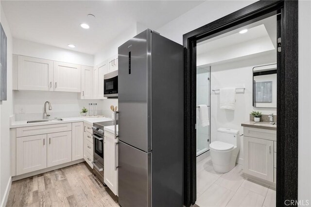 201 S Juanita Ave, Redondo Beach, CA 90277 - kitchen with stainless steel appliances, light countertops, white cabinetry, and recessed lighting