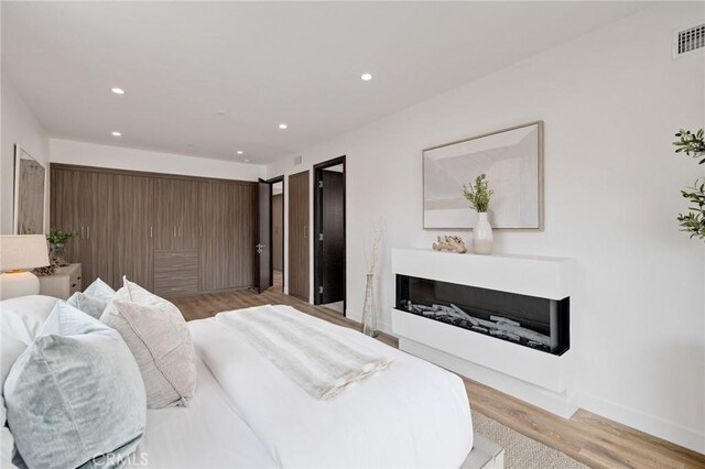 201 S Juanita Ave, Redondo Beach, CA 90277 - bedroom with recessed lighting and light wood-style floors
