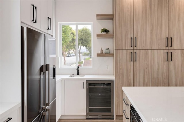 201 S Juanita Ave, Redondo Beach, CA 90277 - kitchen with wine cooler, stainless steel fridge, open shelves, light countertops, and white cabinets