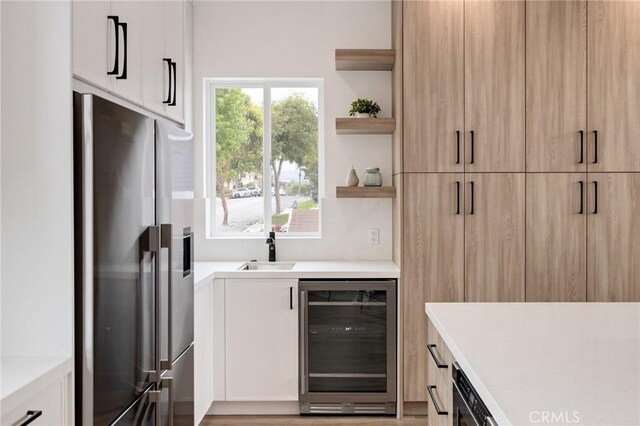 201 S Juanita Ave, Redondo Beach, CA 90277 - kitchen featuring stainless steel fridge, beverage cooler, open shelves, light countertops, and white cabinets