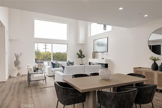 201 S Juanita Ave, Redondo Beach, CA 90277 - dining room with light wood finished floors, recessed lighting, and a towering ceiling