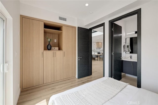 201 S Juanita Ave, Redondo Beach, CA 90277 - bedroom with light wood-type flooring, connected bathroom, and recessed lighting