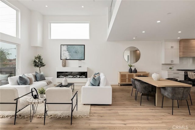 201 S Juanita Ave, Redondo Beach, CA 90277 - living area with a high ceiling, recessed lighting, and light wood-style floors