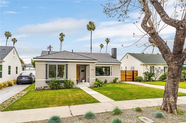 3876 Edgehill Dr, Los Angeles, CA 90008 - bungalow-style house with stucco siding, roof with shingles, and driveway
