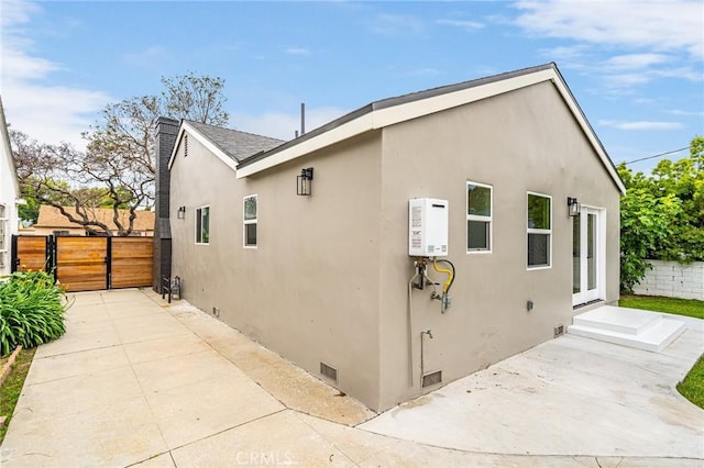 3876 Edgehill Dr, Los Angeles, CA 90008 - view of side of property featuring crawl space, fence, stucco siding, and a patio