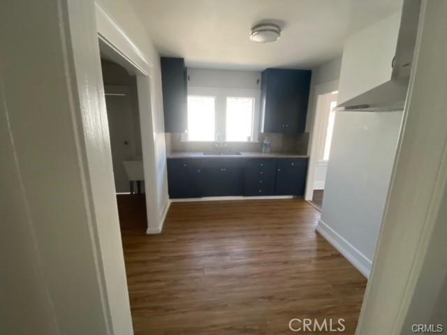 3030 W 12th Pl, Los Angeles, CA 90006 - interior space with baseboards and dark wood-style floors