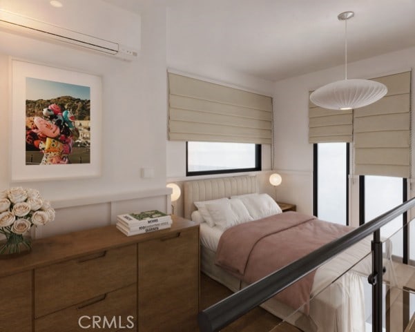3030 W 12th Pl, Los Angeles, CA 90006 - bedroom featuring a wall mounted air conditioner and multiple windows