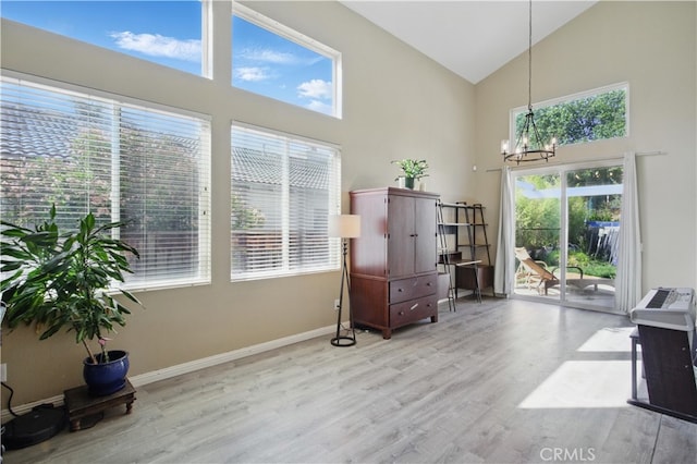 45924 Via Ln, Colorada, Temecula, CA 92592 - living area featuring high vaulted ceiling, a chandelier, wood finished floors, and baseboards
