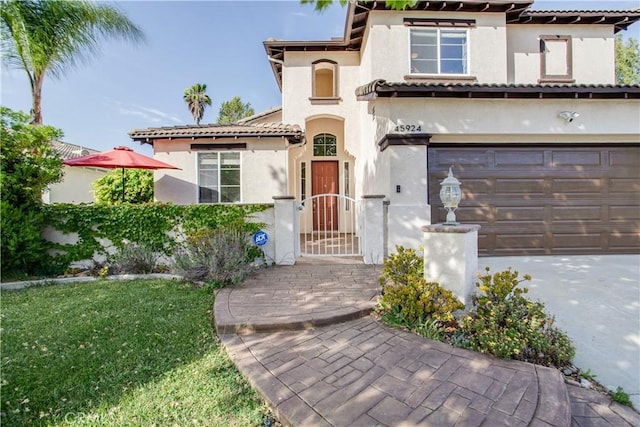 45924 Via Ln, Colorada, Temecula, CA 92592 - mediterranean / spanish house with stucco siding, a garage, a tiled roof, and concrete driveway