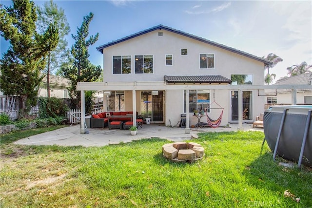 45924 Via Ln, Colorada, Temecula, CA 92592 - rear view of property with stucco siding, a patio, and an outdoor living space with a fire pit