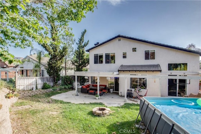 45924 Via Ln, Colorada, Temecula, CA 92592 - back of house featuring stucco siding, a pool, an outdoor hangout area, a patio area, and a tiled roof