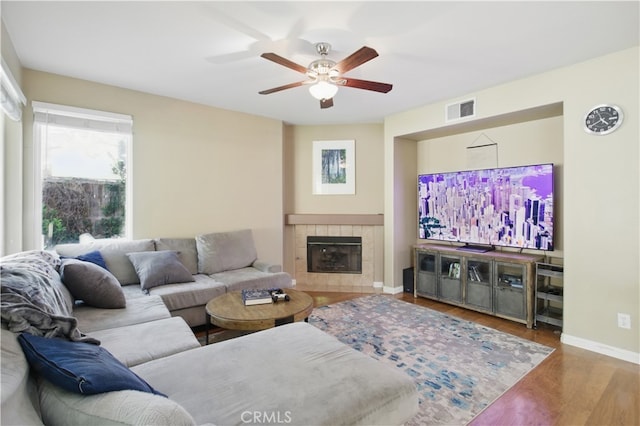 45924 Via Ln, Colorada, Temecula, CA 92592 - living room with wood finished floors, a ceiling fan, baseboards, and a fireplace