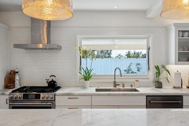 5171 College Gardens Ct, San Diego, CA 92115 - kitchen featuring appliances with stainless steel finishes, wall chimney range hood, decorative backsplash, white cabinets, and light stone countertops