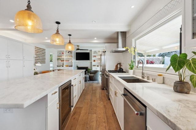 5171 College Gardens Ct, San Diego, CA 92115 - kitchen featuring wall chimney range hood, appliances with stainless steel finishes, beverage cooler, hardwood / wood-style floors, and white cabinetry