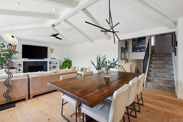 5171 College Gardens Ct, San Diego, CA 92115 - dining space featuring light wood-type flooring, stairs, a chandelier, a fireplace, and recessed lighting