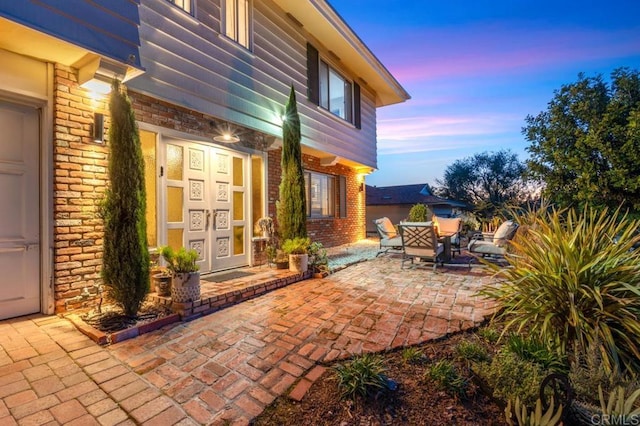5171 College Gardens Ct, San Diego, CA 92115 - patio terrace at dusk with a patio