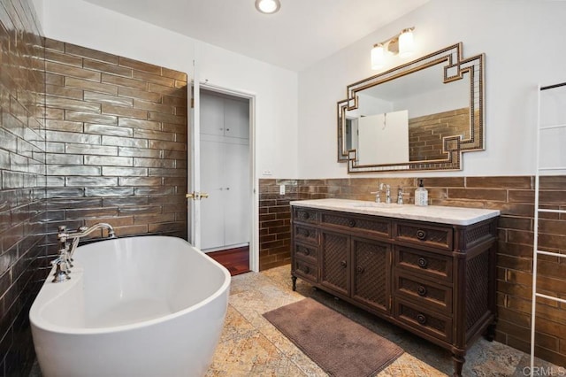 5171 College Gardens Ct, San Diego, CA 92115 - bathroom with tile walls, vanity, a freestanding bath, a wainscoted wall, and recessed lighting
