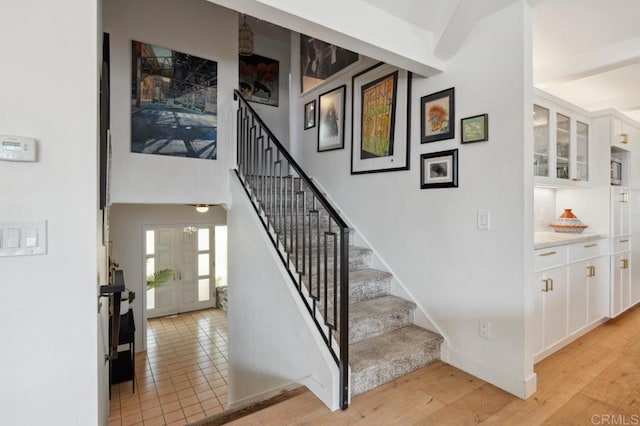 5171 College Gardens Ct, San Diego, CA 92115 - stairs featuring wood finished floors and baseboards