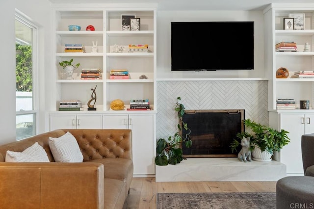 5171 College Gardens Ct, San Diego, CA 92115 - living room with wood finished floors and a fireplace with raised hearth