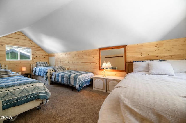 bedroom with lofted ceiling, wooden walls, and carpet