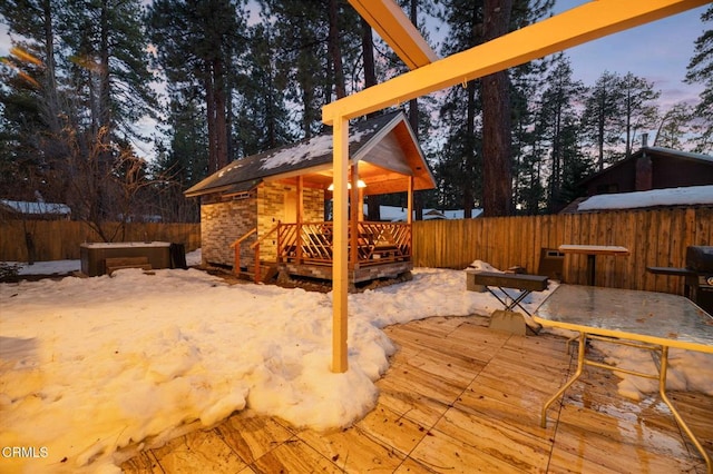 deck with an outbuilding and fence