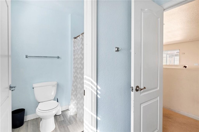 3070 Sand Pine Trl, Hemet, CA 92545 - full bath with baseboards, toilet, and wood finished floors
