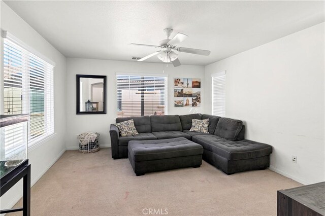 3070 Sand Pine Trl, Hemet, CA 92545 - living room featuring baseboards, light colored carpet, and ceiling fan